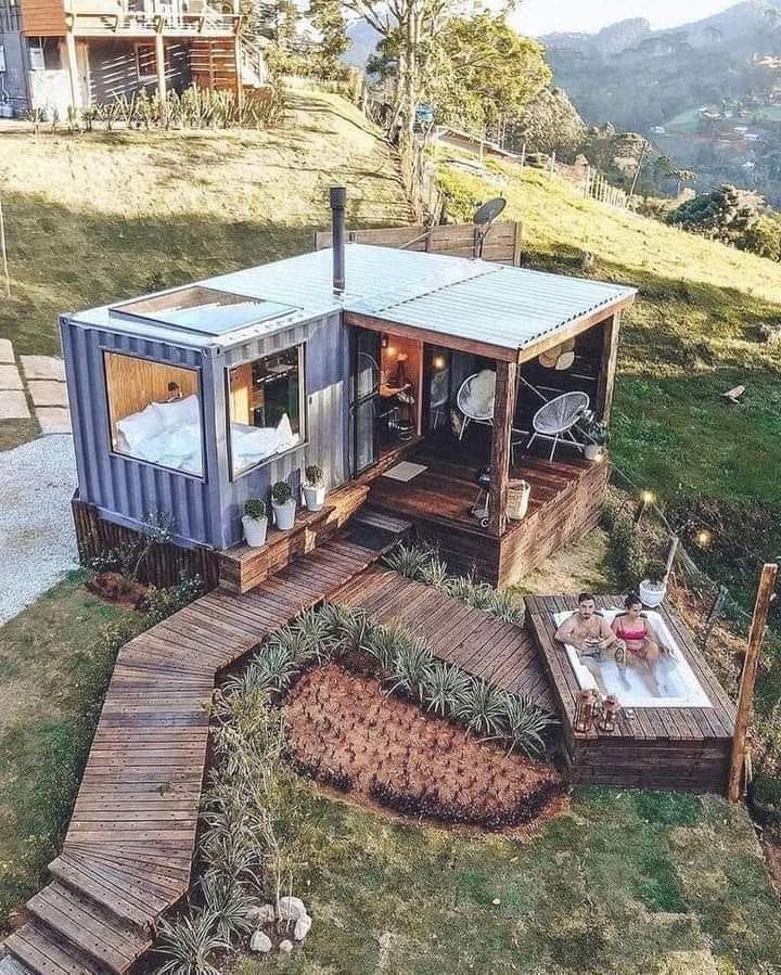 The meme is a picture of a tiny house made from a shipping container, with a small deck and a hot tub. The caption reads "When you finally get your own home, but it's still a shipping container". The image is humorous because it pokes fun at the idea of living in a small, cramped space, even when it's your own home.